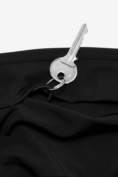 Load image into Gallery viewer, Dryad Gwen recycled polyester running tight, close-up of key pocket.